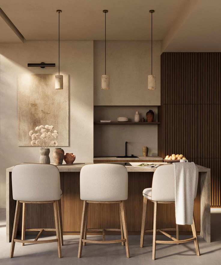 A wood and neutral kitchen with travertine pendant lights