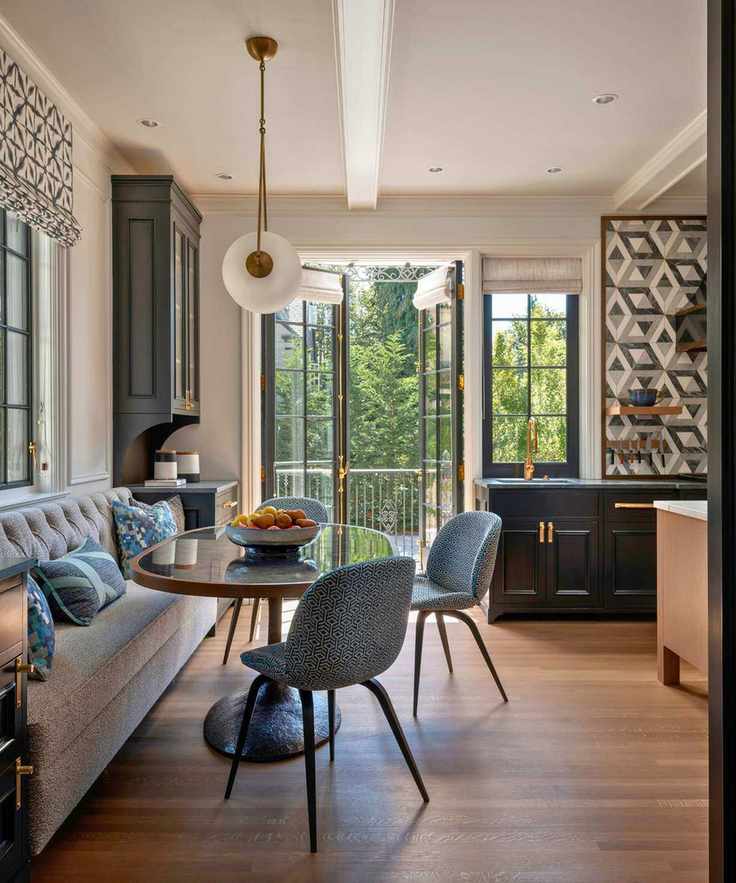 Cozy kitchen dining nook with banquette and round table