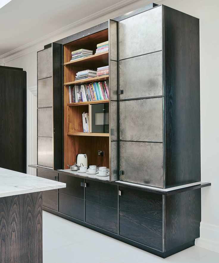 Grey kitchen with metallic fronted cabinet