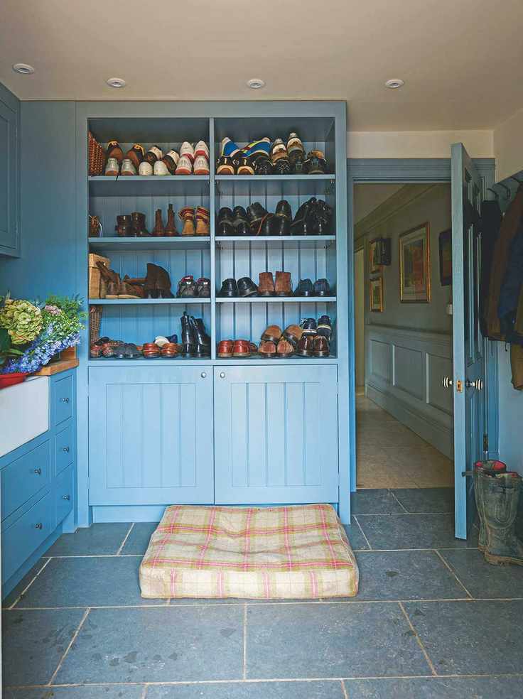 boot room with blue painted cabinets