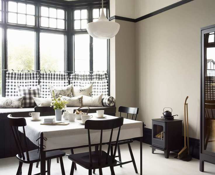 Stylish dining room with a wood burner