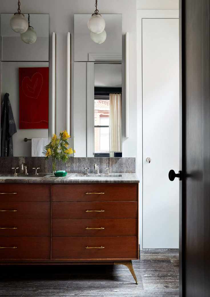 Stained wood sink drawers, twin sinks and mirrors