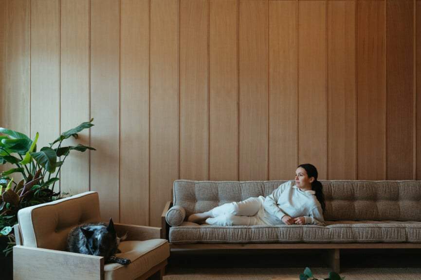 Adriene Mishler with her dog on the couch.