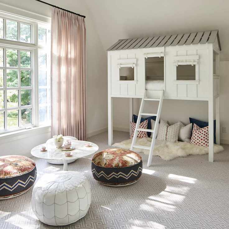 playroom with tree house, cushions, pouffes, low table, carpet, pink drapes