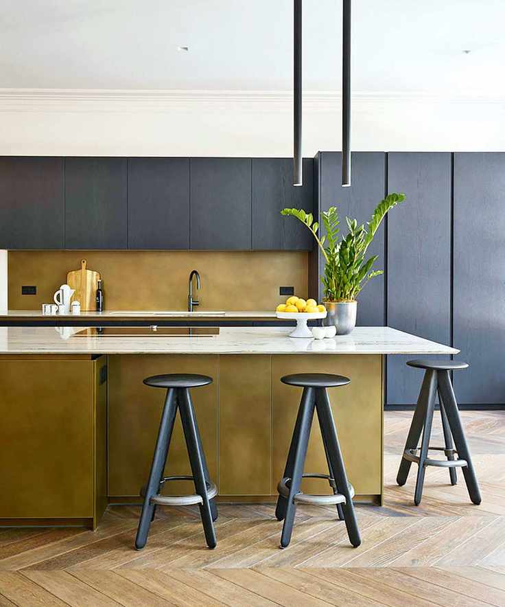 family kitchen with island and overhead lighting