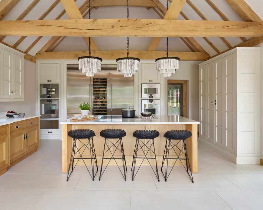 Kitchen with wood and painted cabinets and island