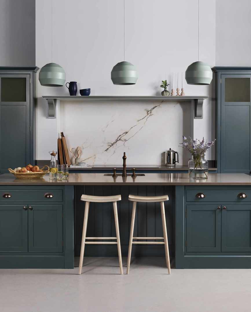 Kitchen with painted cabinets and island with pendant lights