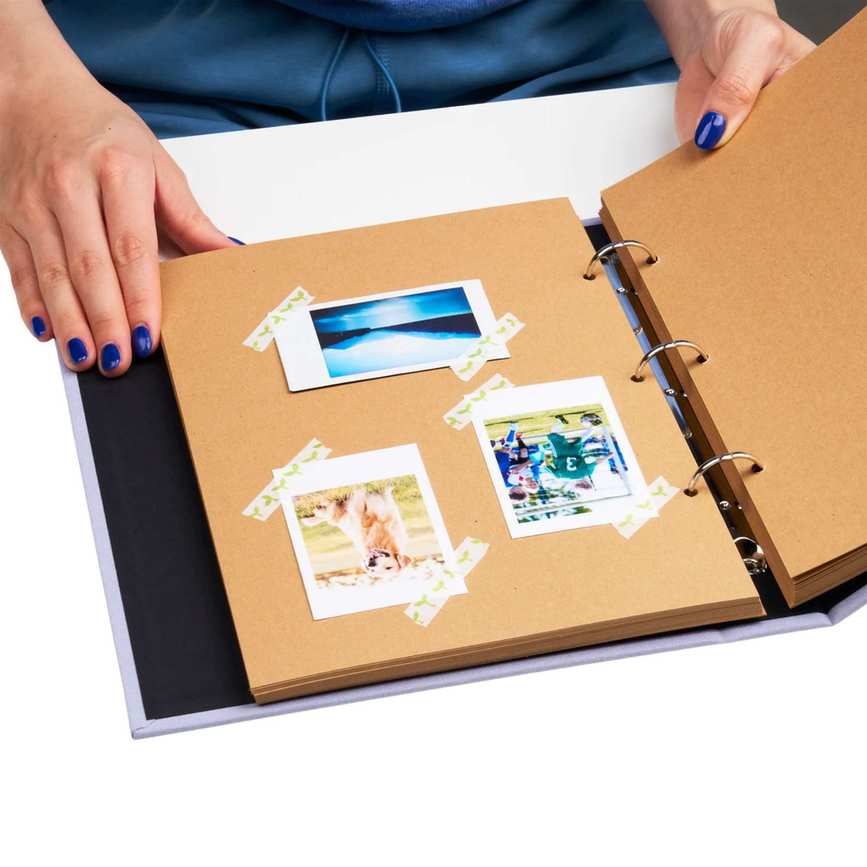 A scrapbook with polaroids