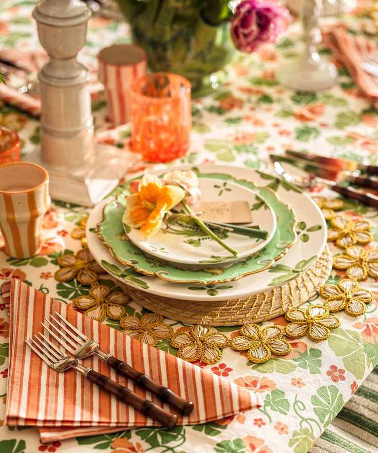 A detailed shot of a place setting with a green scalloped plate