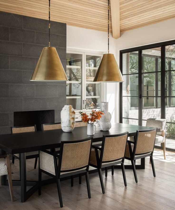 modern farmhouse dining room with wood ceiling and large brass pendant lights