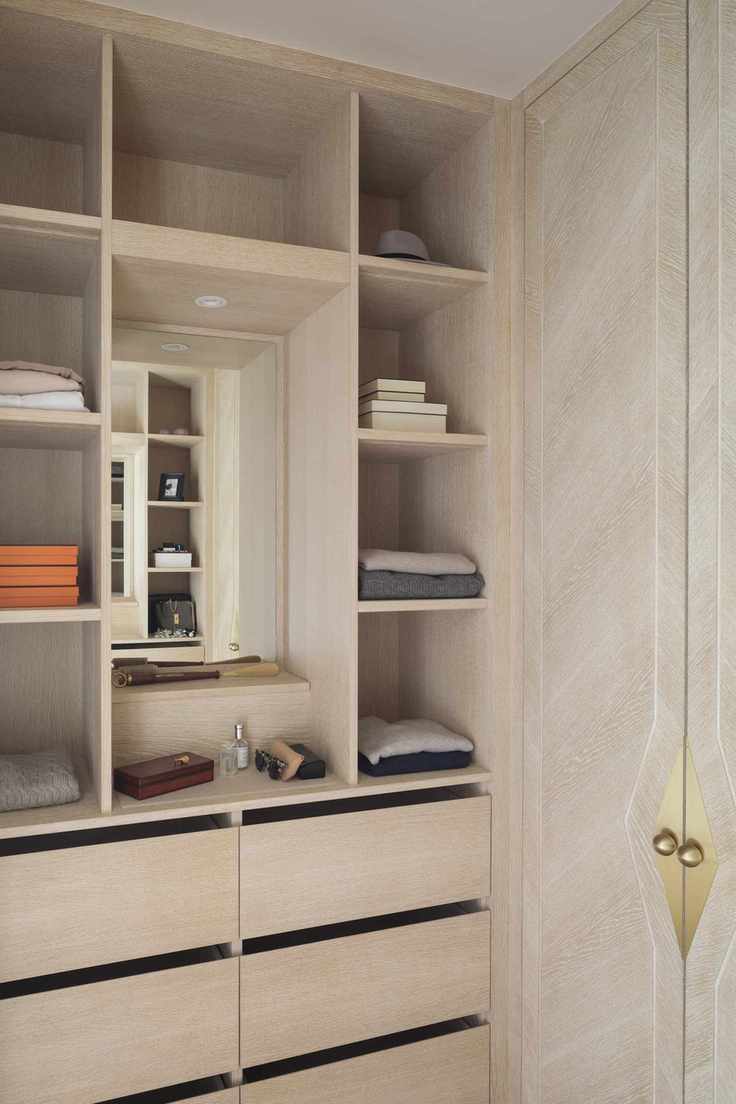 mini make up vanity in custom closet with storage each side and drawers underneath, small mirror and shelf for brushes
