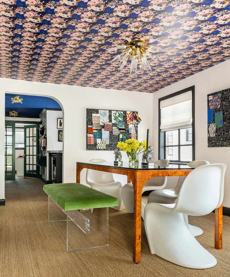 accent wallpapered ceiling in an eclectic dining room