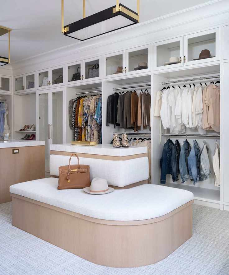 Large walk in wardrobe with round bench in center