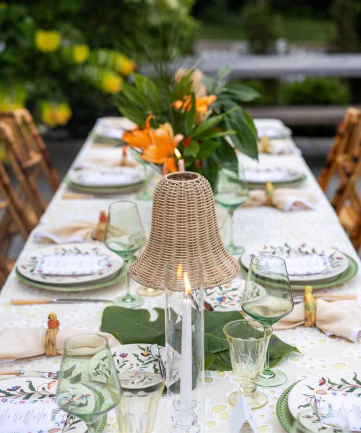 table set with greenery and candles