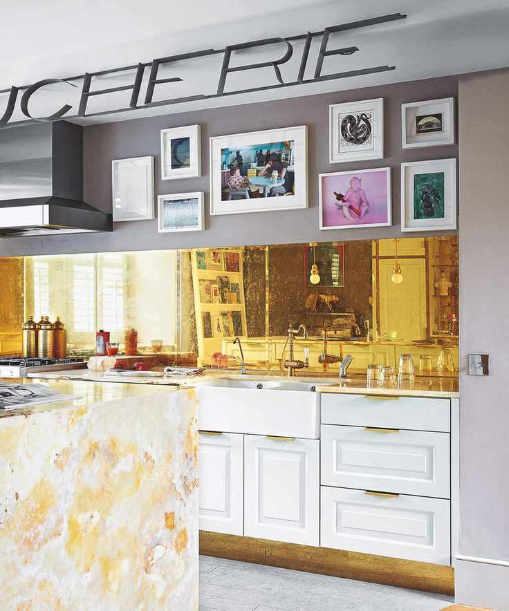 Gallery wall ideas for a kitchen with metal backsplash