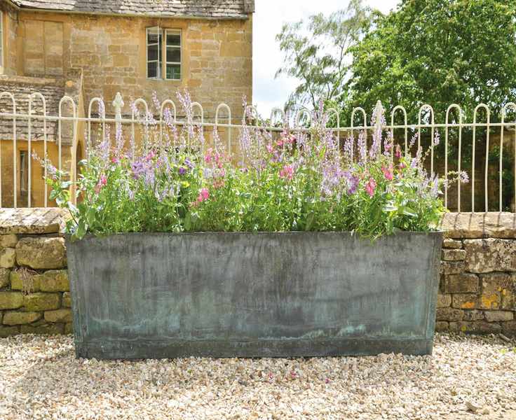 Rectangular metal planter with flowers