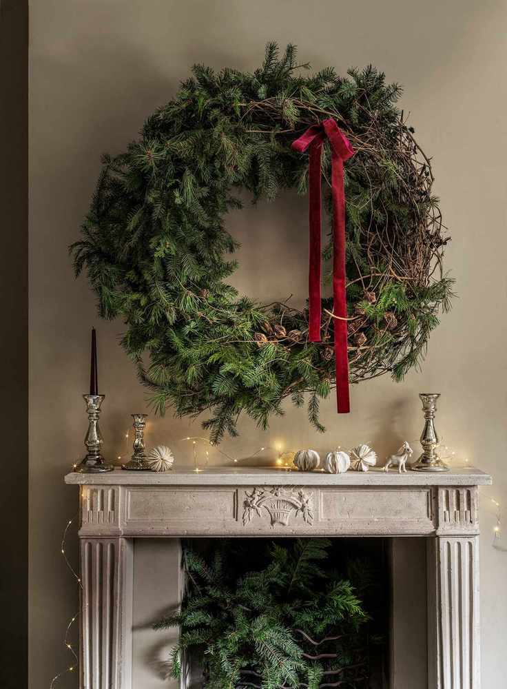 Large wreath above a mantelpiece
