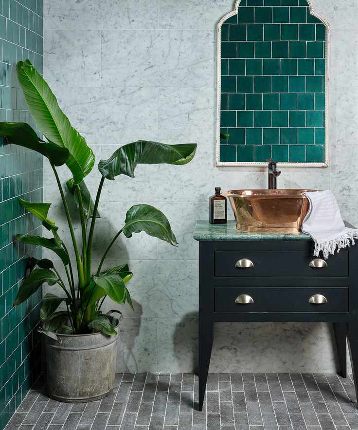 Reformed stone tiles by Ca Pietra in teal and grey with black vanity unit