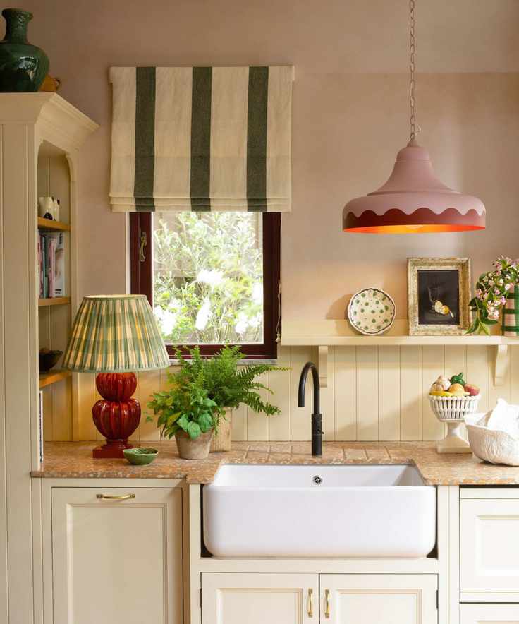 neutral kitchen with raw plaster walls and statement scalloped lighting accessories