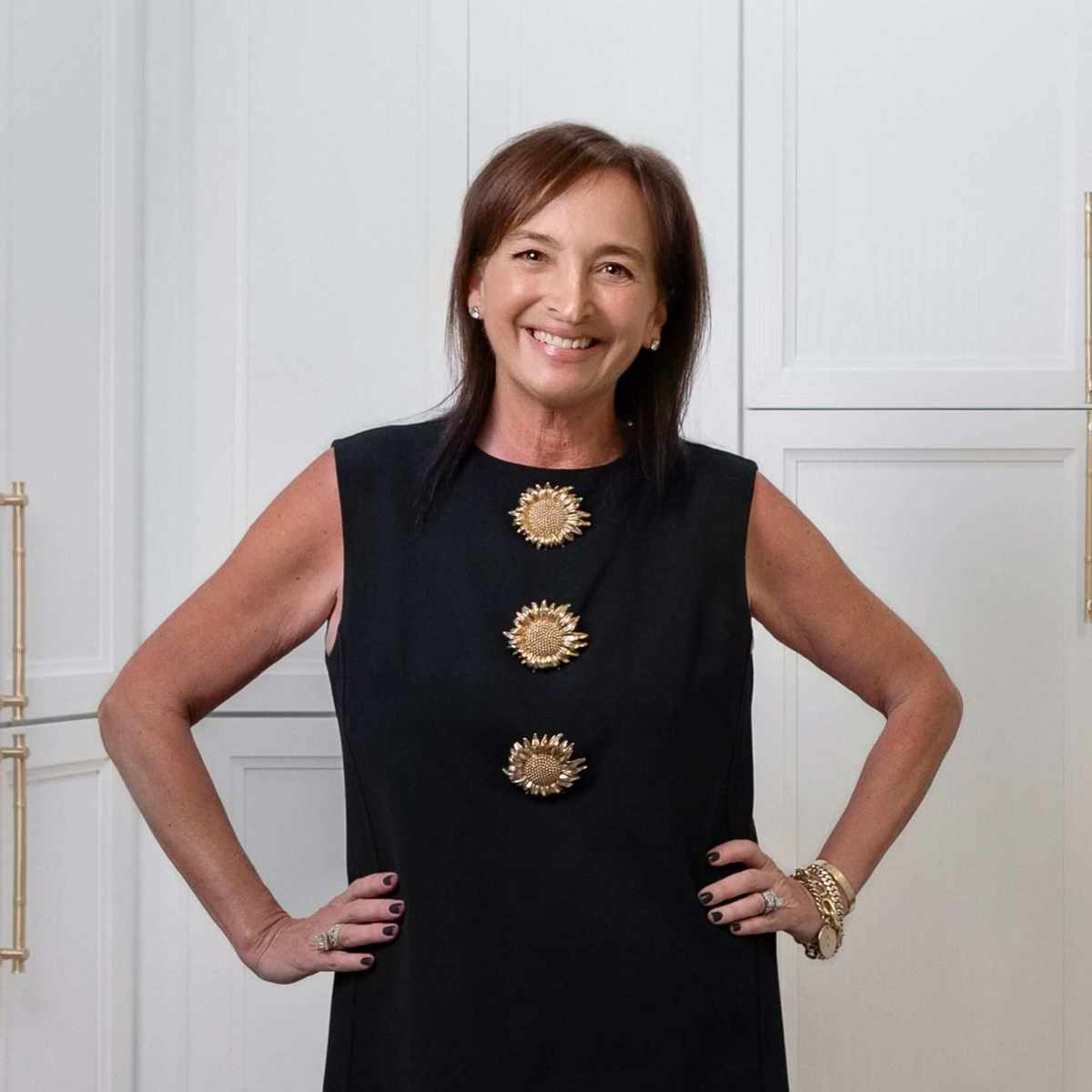 Jennifer Q. Williams - a woman wearing a black dress with brown hair smiling