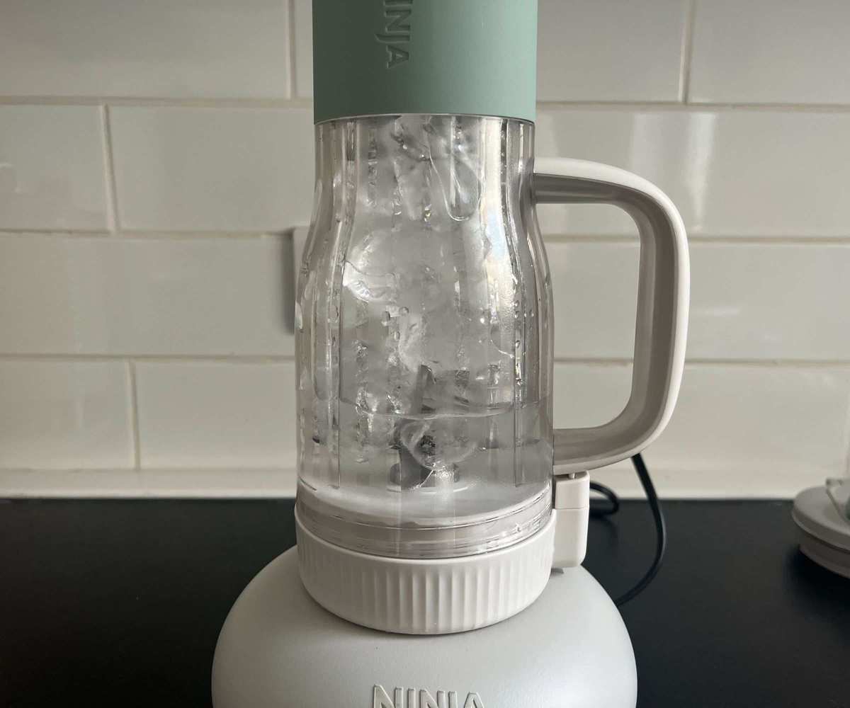 A tumbler filled with ice water.