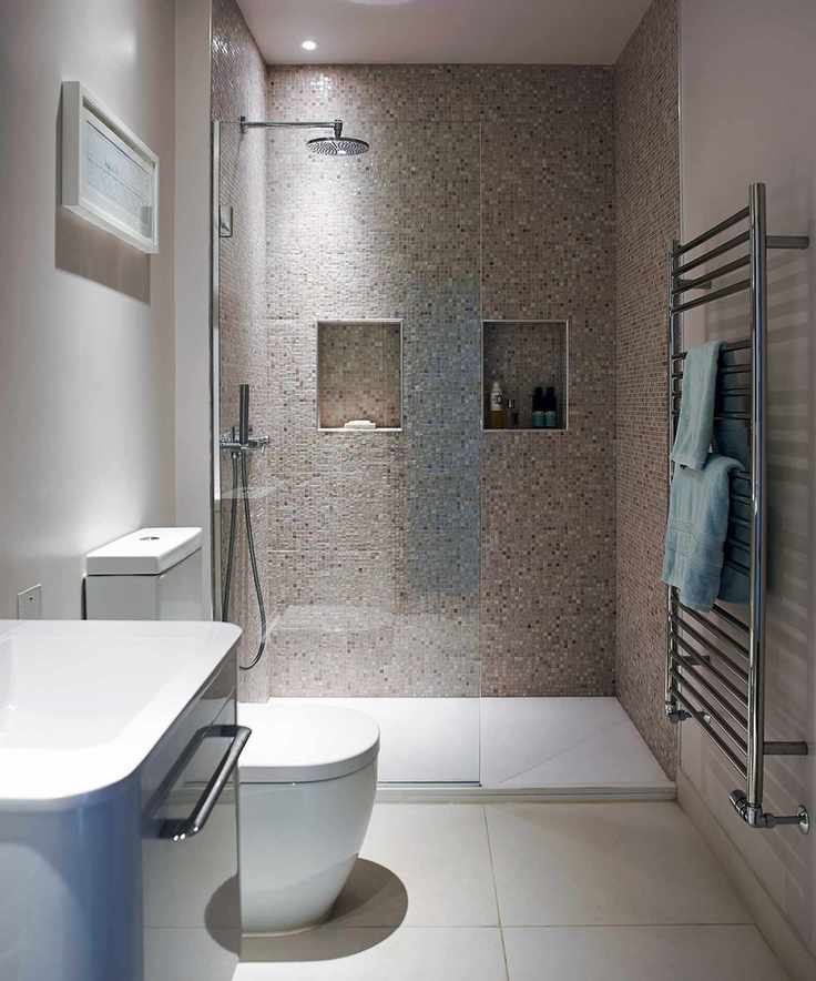 Shower design featuring alcove shelving in gray mosaic tile.