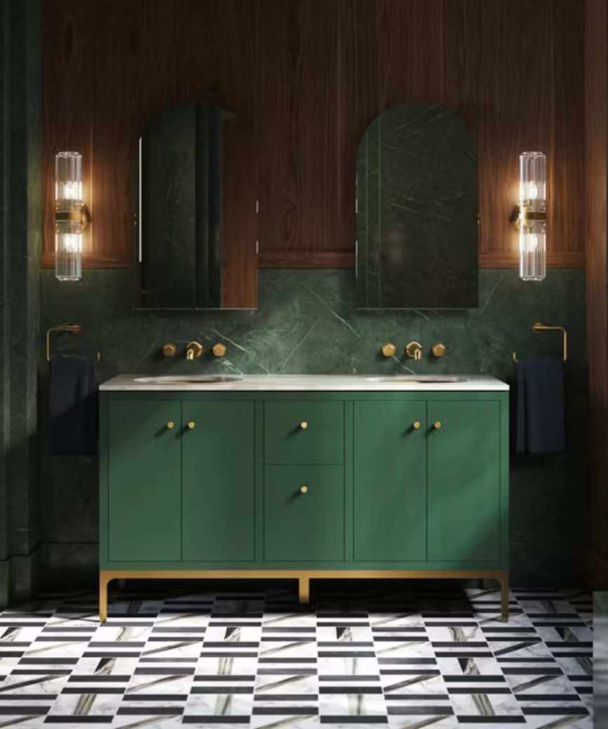 A moody bathroom with a green double vanity, wooden paneling, and patterned floor tiles