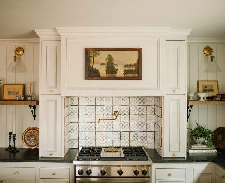 Small white kitchen ideas with warm white hood and tiled backsplash in a farmhouse-style kitchen