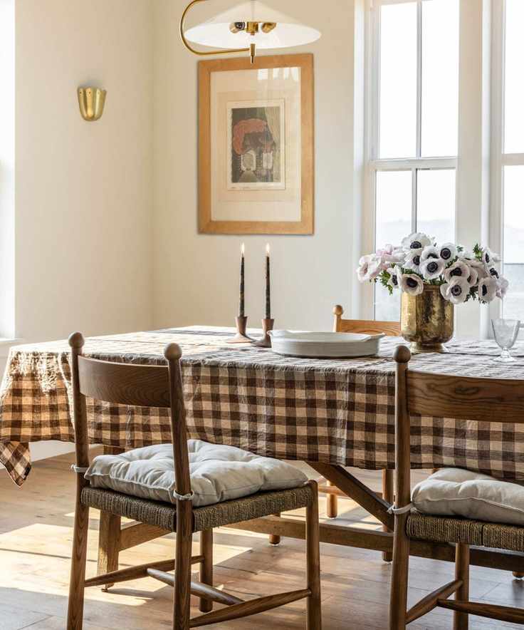 Dining room with vintage chairs and aged metal accents