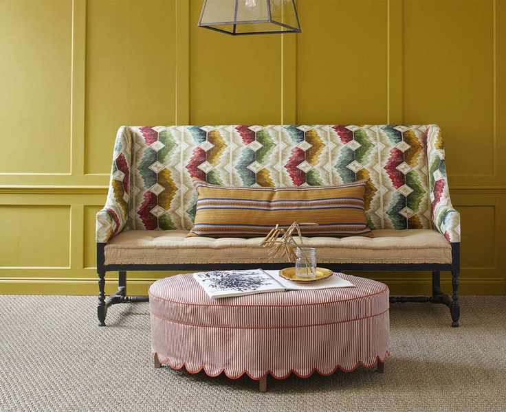 Hallway with painted paneling and colorful furnishings
