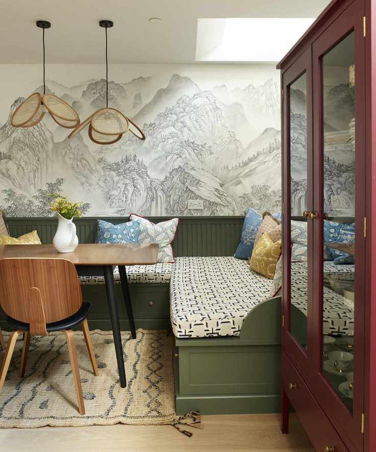 dining nook in corner with red dresser