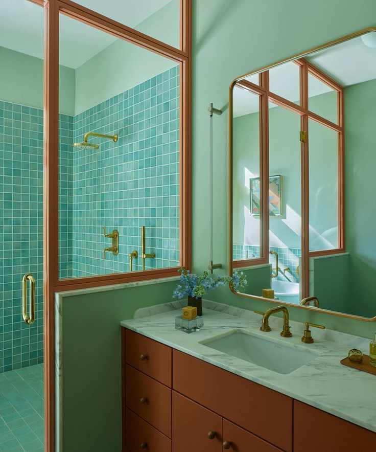 Modern bathroom featuring pistachio and terracotta tones.
