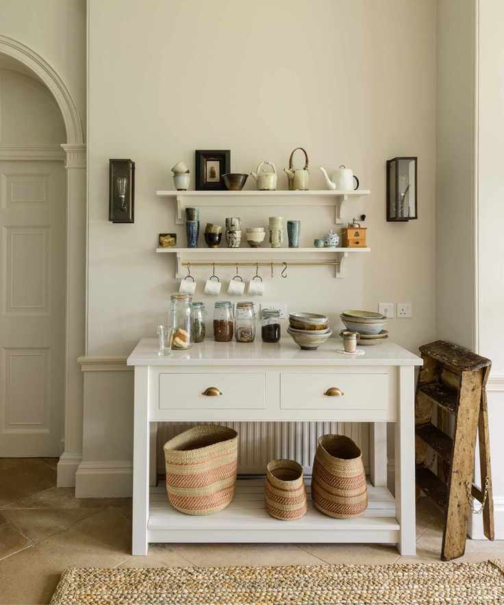Free-standing coffee bar with open storage and hooks for hanging mugs