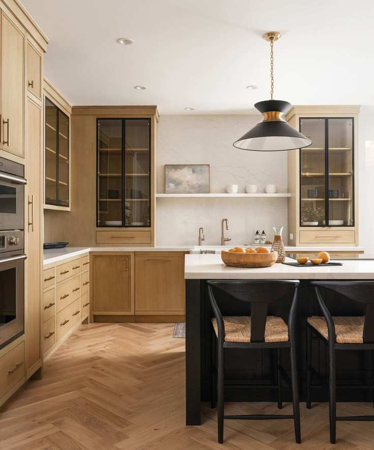 A wooden kitchen with glass cabinets