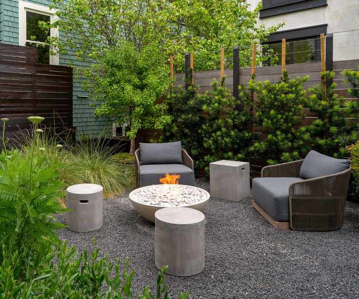 gravel patio seating area with fire pit