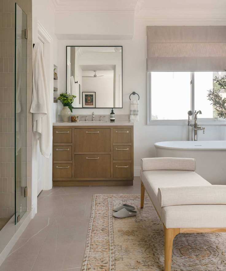 Neutral bathroom with wooden cabinet and gray blind