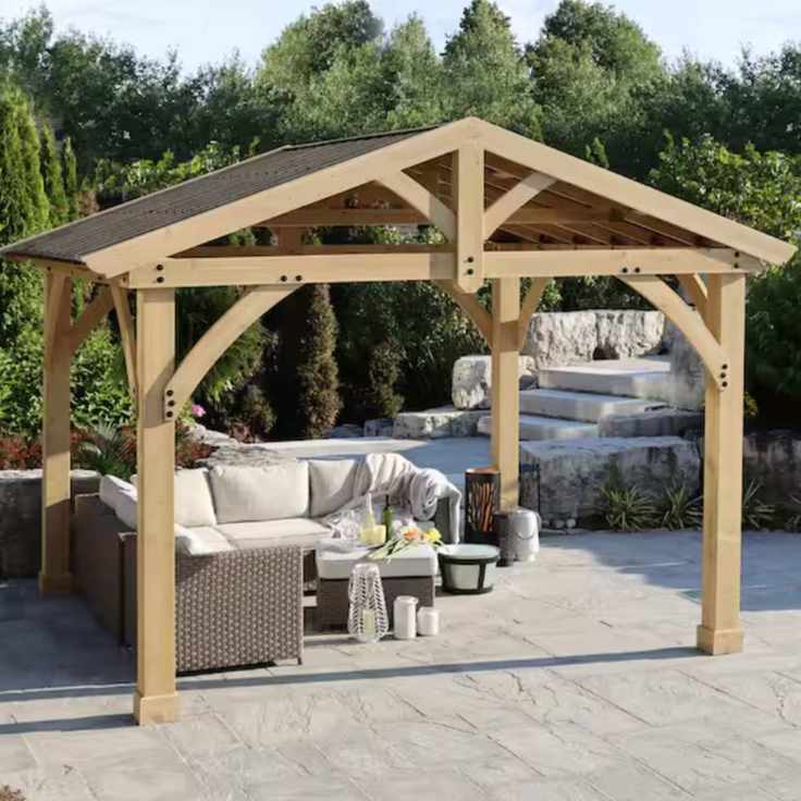 Wooden framed gazebo over outdoor furniture