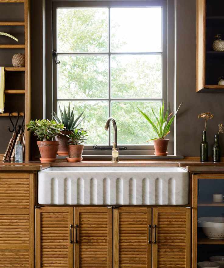 deVOL kitchen sink with houseplants