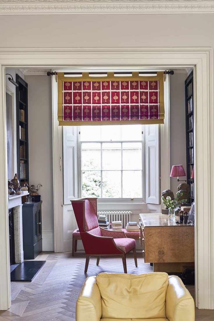 Blinds in Ozone in Ruby bordered with Alto in Lemon, both Christopher Farr Cloth