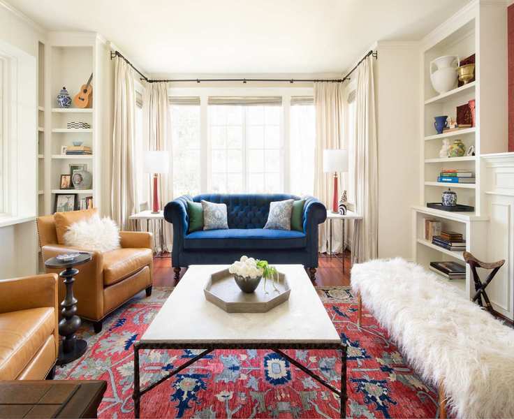 cape cod living room with shaggy sheepskin bench and oriental rug