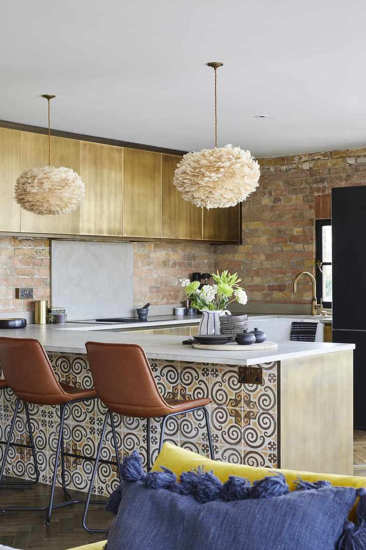 Kitchen with peninsular cabinets with patterned tile, bar stools and wood cabinets