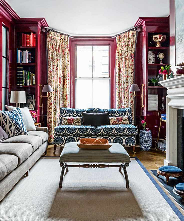 Bookshelf in a living room with red bay window bookshelves