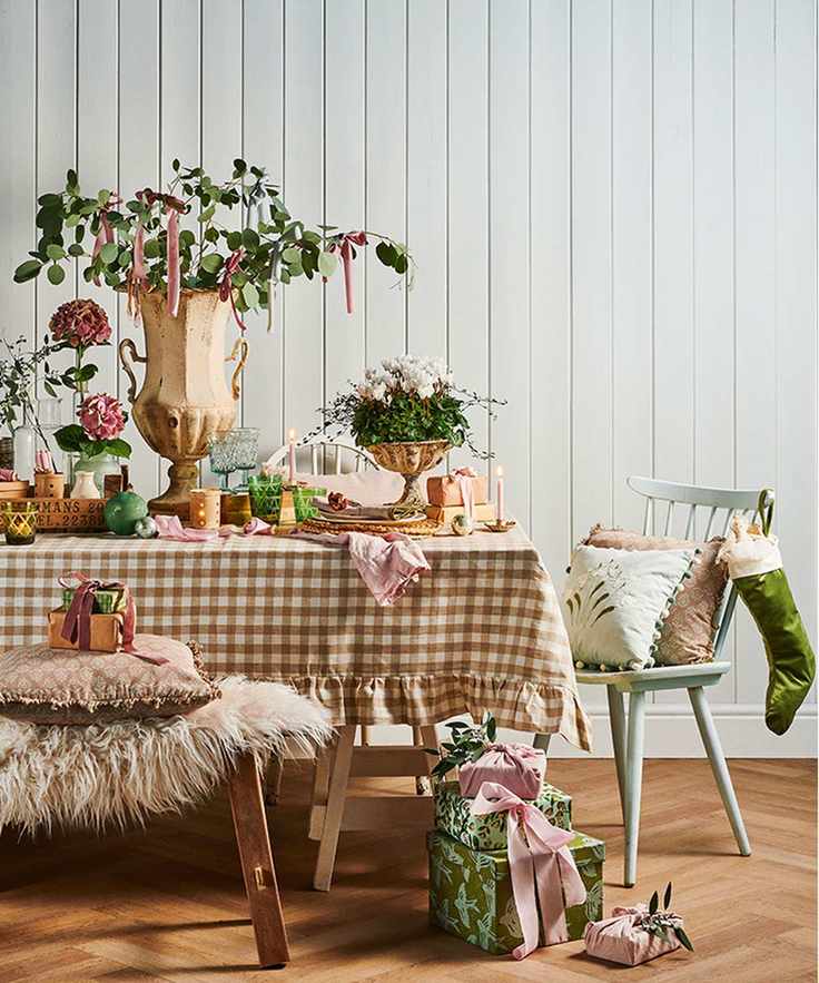 Christmas table centerpiece with vintage urns and flowers