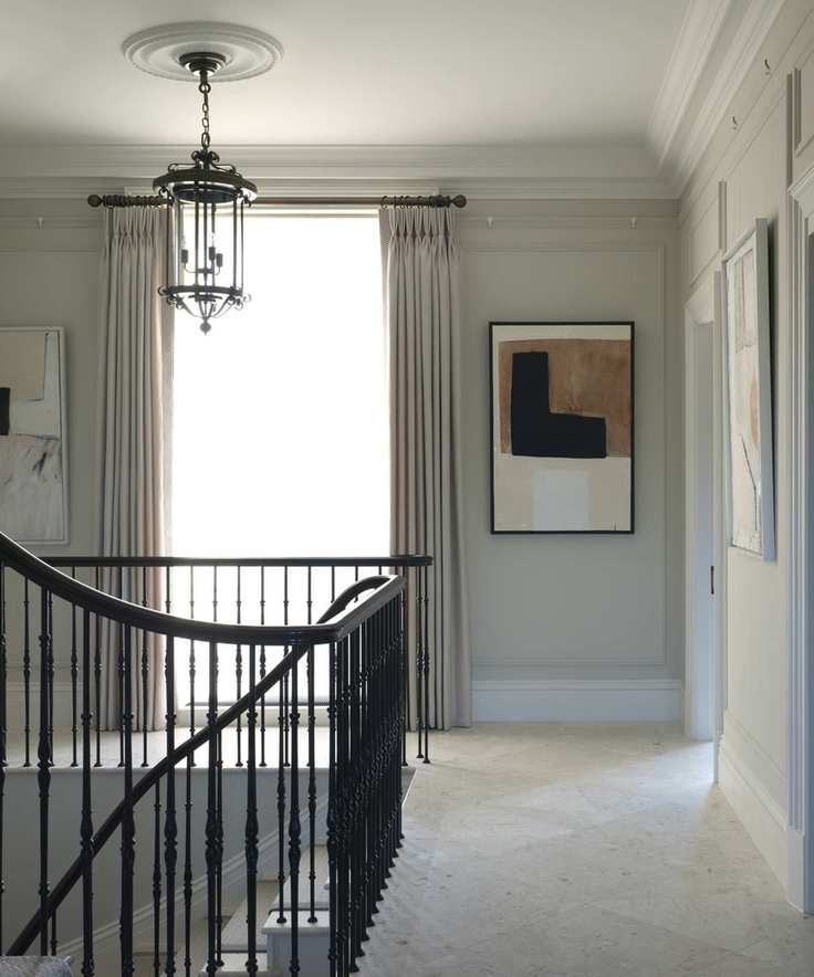 A modern hallway with natural stone flooring