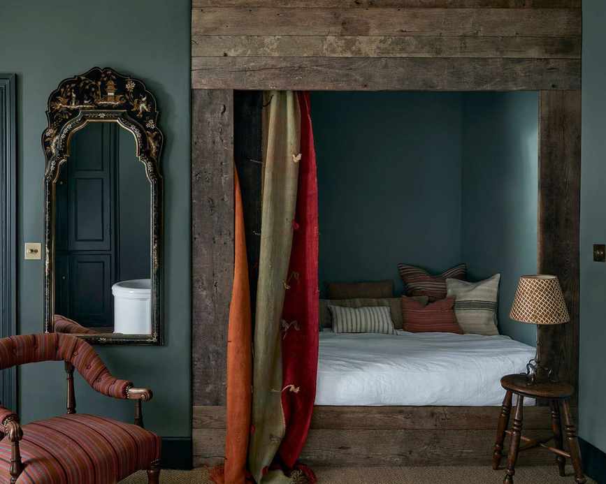 Dark bedroom corner with grey wall