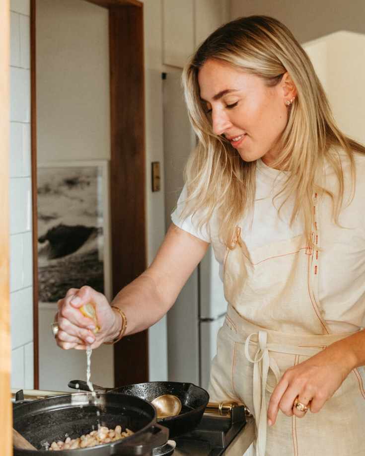olivia muniak cooking in kitchen, pans, lemon citrus squeeze