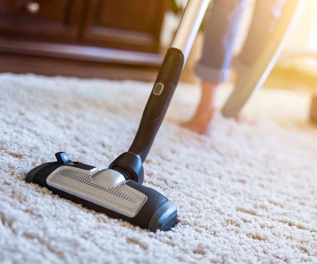 Vacuuming carpet