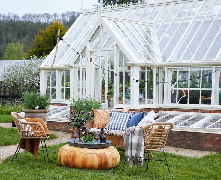large greenhouse with seating area