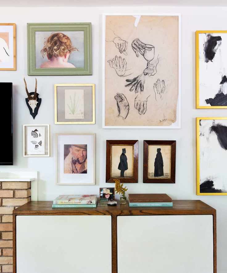 A gallery wall with bright pictures