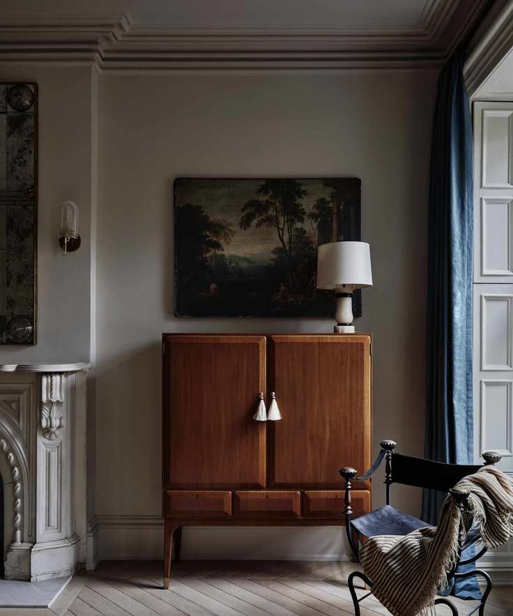 vintage cabinet in a fireplace alcove